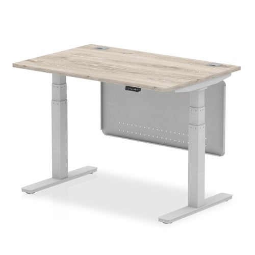 Air Modesty 1200 x 800mm Height Adjustable Office Desk With Cable Ports Grey Oak Finish Silver Frame With Silver Steel Modesty Panel - HA01409 DD